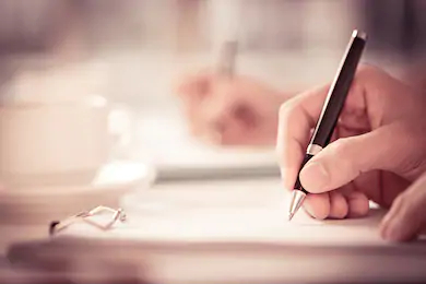 close-shot-human-hand-writing-260nw-176615030.jpg