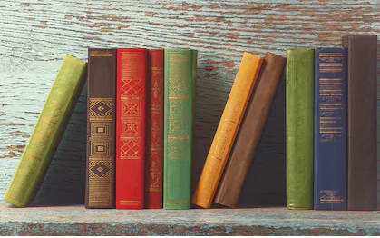 old-books-on-background-wooden-260nw-522019972.jpg